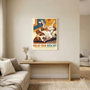 May include: A rectangular wall art print featuring a brown and white dog lying on its back with its tongue out. The text reads BELLY RUB RESORT and The locals insist on extended stays. The illustration uses a warm color palette of orange and blue.