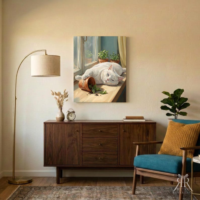 May include: A rectangular wall art print featuring a white cat lying on a windowsill next to a tipped-over terracotta pot with green leaves. The scene includes a window frame and two small potted plants in the background, rendered in a painterly style.