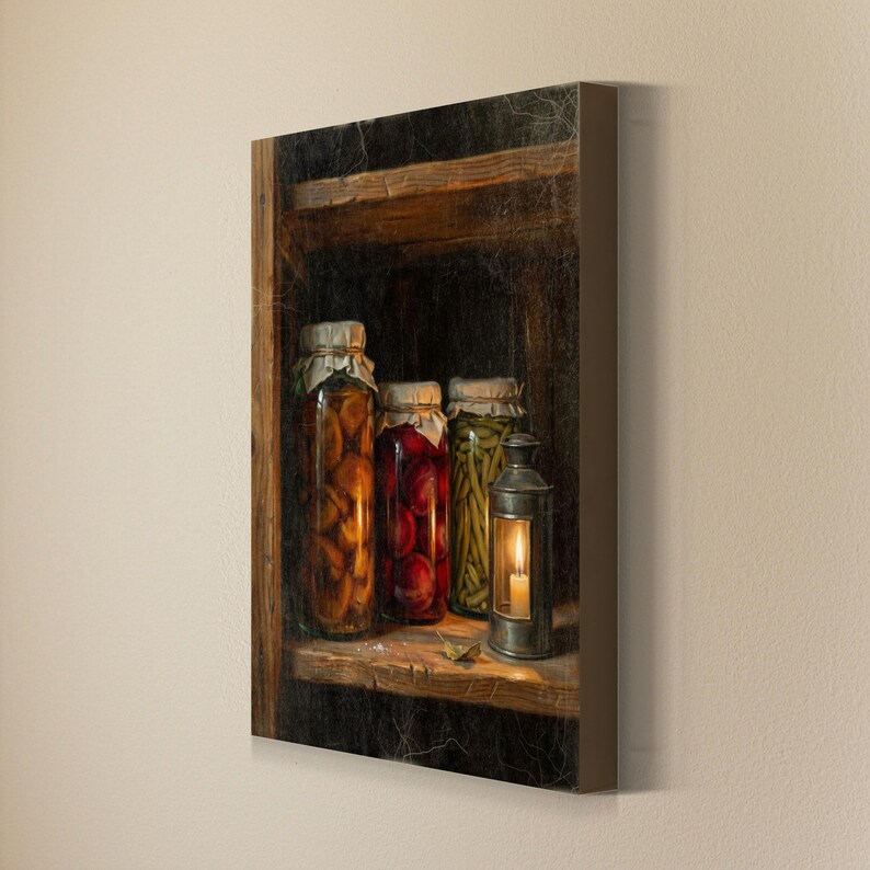 May include: A rectangular canvas print depicting a dark wooden shelf holding three glass jars filled with preserved fruits and vegetables, alongside a metal lantern with a lit candle inside. The scene features a textured, aged appearance.