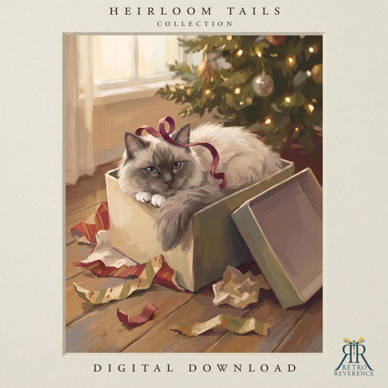 May include: A digital illustration titled Heirloom Tails Collection featuring a fluffy ragdoll cat with grey and white fur sitting inside an open cardboard gift box with a red ribbon on its head, surrounded by torn wrapping paper near a Christmas tree.