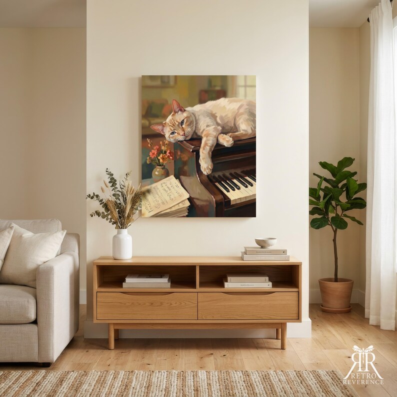 May include: A wall art print featuring a light-colored cat resting on top of a dark wooden piano. Beside the piano, a small vase holds orange flowers, and a stack of sheet music rests on the surface. The scene is rendered in a painterly style.