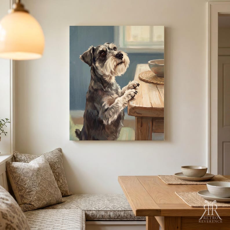 May include: A wall art print featuring a painting of a grey and white Schnauzer dog standing on its hind legs, resting its front paws on a wooden table. The dog looks upward towards a bowl placed on the table surface in a bright, indoor setting.