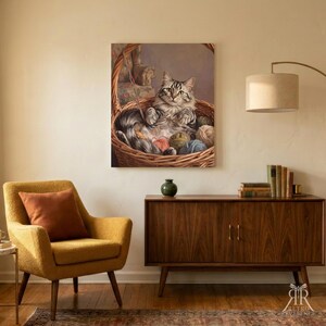 May include: A rectangular wall art print featuring a fluffy grey and white tabby cat sitting inside a woven wicker basket filled with colorful balls of yarn. The cat has green eyes and is looking forward, surrounded by various textured yarn spheres.