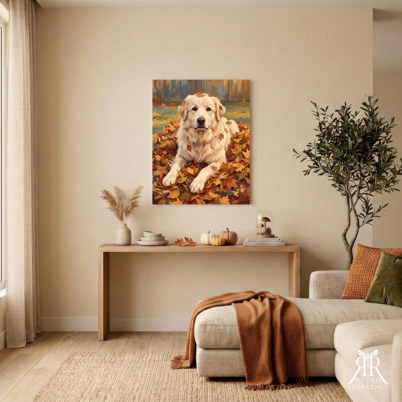 May include: A rectangular wall art print featuring a golden-colored dog lying down in a pile of fallen autumn leaves. The dog has light fur and is positioned centrally, surrounded by orange, yellow, and brown foliage in a forest setting.