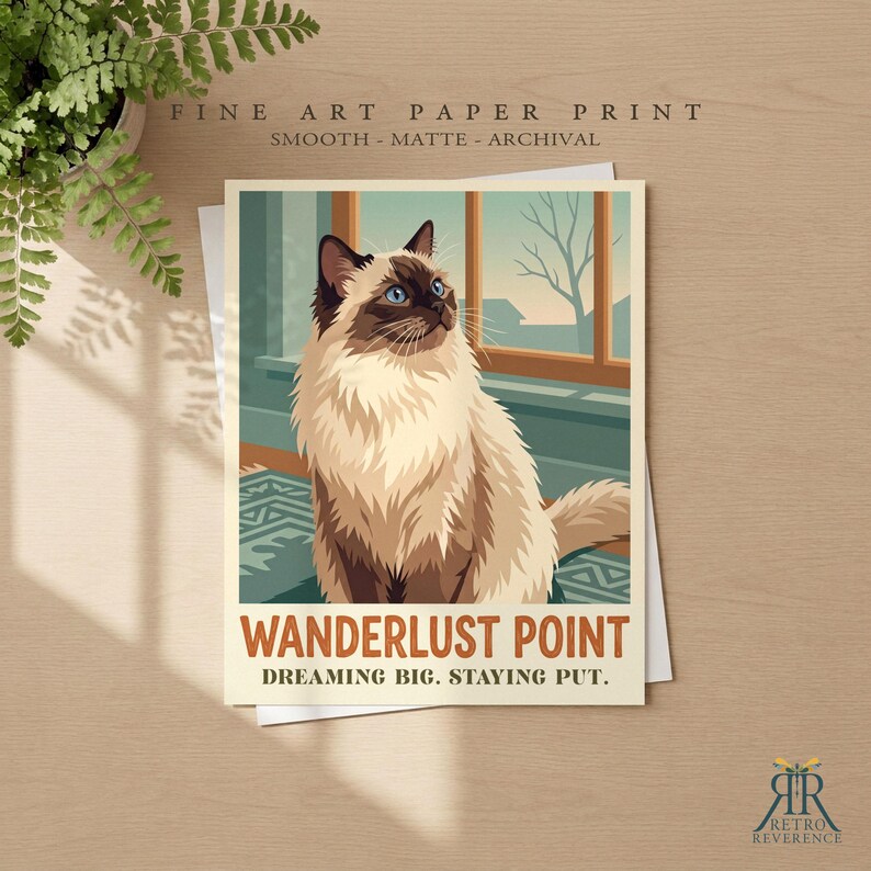 May include: A fine art paper print featuring a long-haired cat with cream and brown fur sitting near a window. The print includes the text WANDERLUST POINT and DREAMING BIG. STAYING PUT. The design is smooth, matte, and archival quality.