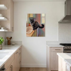 May include: A square wall art print featuring a painting of a fluffy black cat with long fur sitting on the edge of a kitchen sink. The cat has bright yellow eyes and a bushy tail. The background shows a window, a small potted plant, and cabinets.
