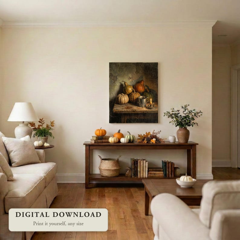 Vintage style still life of pumpkins and gourds by candlelight, hung on a wall in a cozy living room decorated for fall, shown as a digital file you print yourself