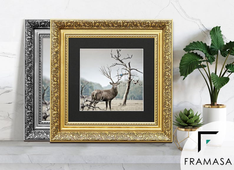 Ornate gold and silver square picture frames With black matt & vintage detailing displaying wildlife wall art on table, styled as elegant home decor. perfect for living room decor, office decor, farmhouse decor, and classic gallery wall styling