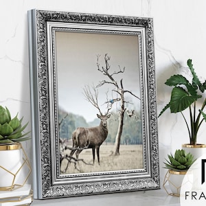 Ornate Silver picture frame featuring sideview on light grey surface, styled as elegant home decor. Decorative traditional poster frame and photo frame with intricate vintage detailing, perfect for living room decor, office decor, farmhouse decor, and classic gallery wall display