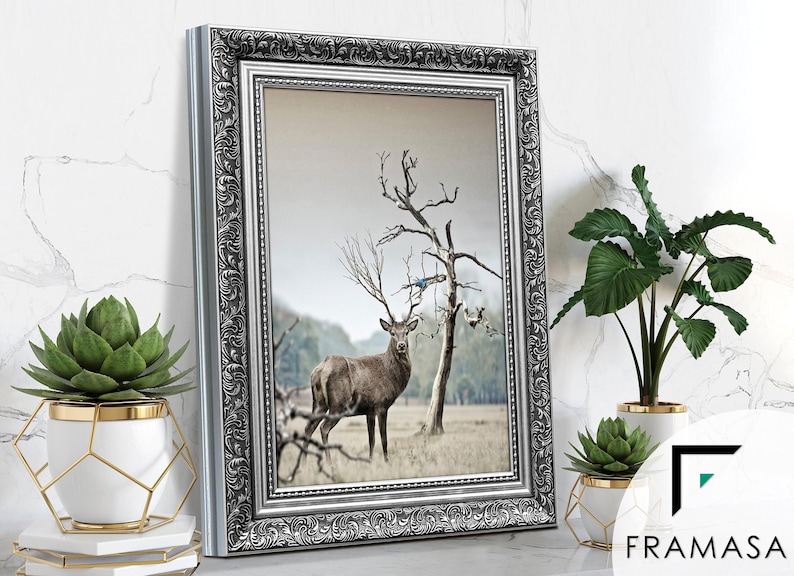 Ornate Silver picture frame featuring sideview on light grey surface, styled as elegant home decor. Decorative traditional poster frame and photo frame with intricate vintage detailing, perfect for living room decor, office decor, farmhouse decor, and classic gallery wall display
