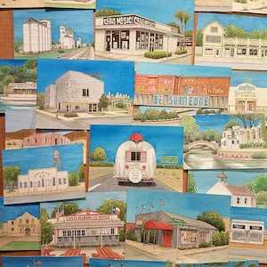 May include: A collection of watercolor paintings depicting various buildings and scenes from a small town. The paintings feature a variety of styles and colors, including a train station, a music store, a theater, and a ice cream shop. The paintings are all framed and ready to hang.