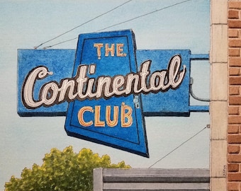 Puede incluir: Un letrero azul y blanco con el texto "THE Continental CLUB" en una fuente de estilo vintage. El letrero está colgado de un edificio de ladrillo.