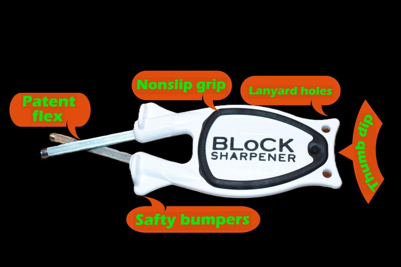 May include: White and black Block Sharpener with a non-slip grip, lanyard holes, and safety bumpers. The sharpener has a patent flex and a thumb dip. The text "BLOCK SHARPENER" is printed on the product.