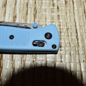 May include: A set of three ceramic mugs with a speckled, matte finish. The mugs are in shades of cream, light gray, and dark gray. Each mug has a simple, minimalist design and a rounded handle.