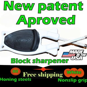 May include: A white block sharpener with a black, textured grip and two honing steels. The text "New patent Aproved" and "Block sharpener" are displayed in green. The text "Made in the USA" is also visible.