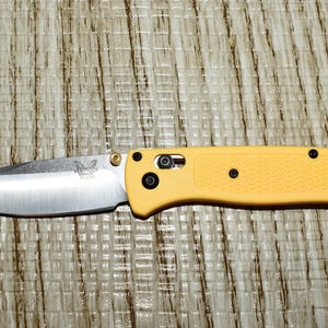 Benchmade Bugouts, Block sharpener Bonus deal. One patent sharpener to keep blades like new. Yellow