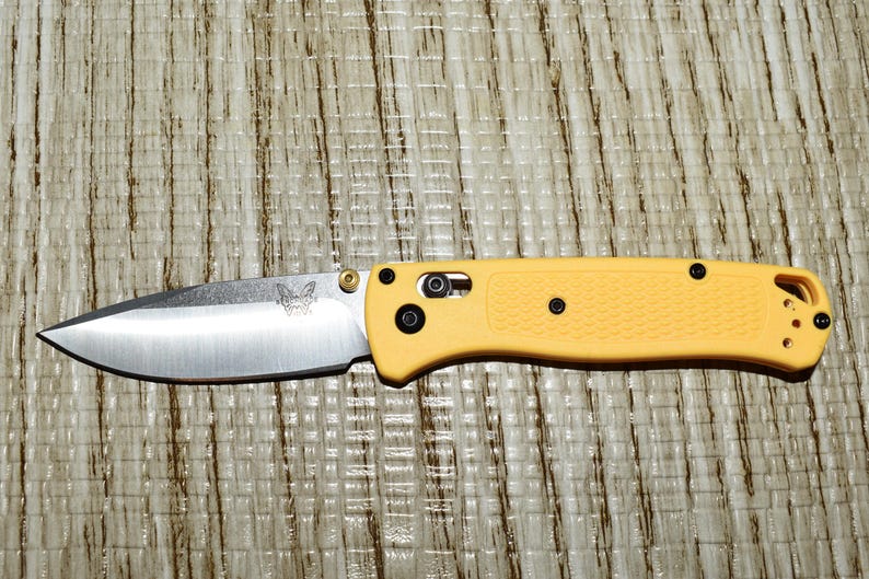 Benchmade Bugouts, Block sharpener Bonus deal. One patent sharpener to keep blades like new. Yellow