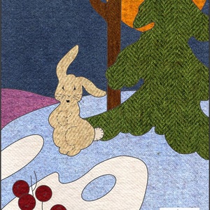 May include: A brown bunny with a white tail stands in a snowy winter scene. A green pine tree and a brown tree stand behind the bunny. The sky is blue and there is a large orange sun in the background. The text "Winter" is at the top of the image. The image is from McKims Studios.