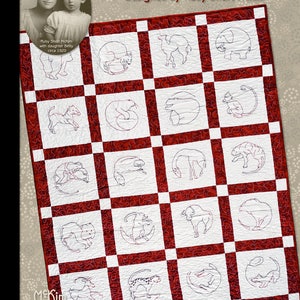 May include: A red and white quilt with a pattern of animals in circles. The quilt is titled "Roly Poly Circus Quilt" and is designed by Ruby Short McKIm. The quilt is created by Janette Dwyer.