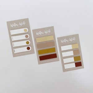 May include: Three sets of colourful sticky notes with the text "Willow-White Stationery Co." printed on each card. The notes are in various shades of brown, yellow, and red.