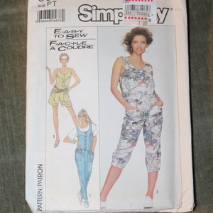 May include: A sewing pattern for a pair of overalls. The pattern includes three different styles: a floral print, a solid blue, and a solid yellow. The pattern is from Simplicity and is number 8688.
