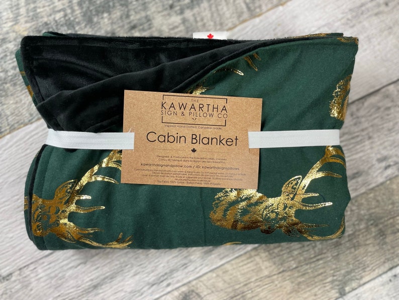Hunter Green Blanket with gold foil stag print, blanket wrapped with cabin blanket tag from the Kawartha sign & Pillow Co