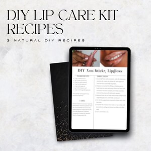 May include: A digital tablet displays a DIY lip gloss recipe with ingredients and instructions. The text "DIY Lip Care Kit Recipes" is at the top, with "3 Natural DIY Recipes" below. A black card with gold speckles is in the foreground.