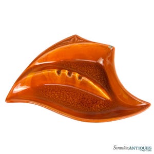 May include: A set of three ceramic mugs with a speckled, matte finish. The mugs are in shades of cream, light gray, and dark gray. Each mug has a simple, minimalist design, perfect for coffee or tea.