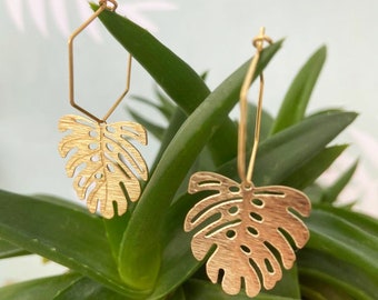 Brass hexagon hoop earrings with brass monstera leaf