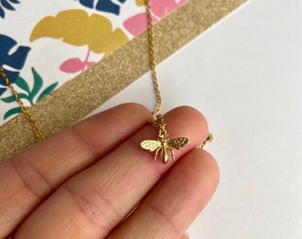 Tiny brass bee necklace