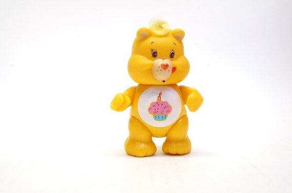 yellow care bear with cupcake