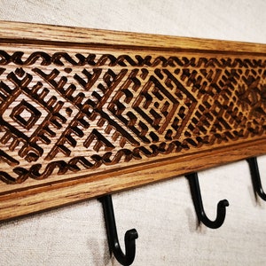 Unique wooden etno-patterned coat hanger, wall mounted, with seven hooks