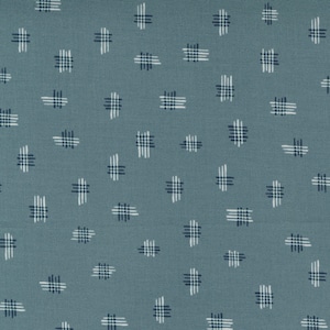 May include: A blue fabric with a white and dark blue checkered pattern.