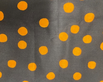 Orange dots on black-flat fold 1 yard cuts 240003