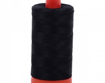 May include: A spool of black thread with an orange plastic bobbin.