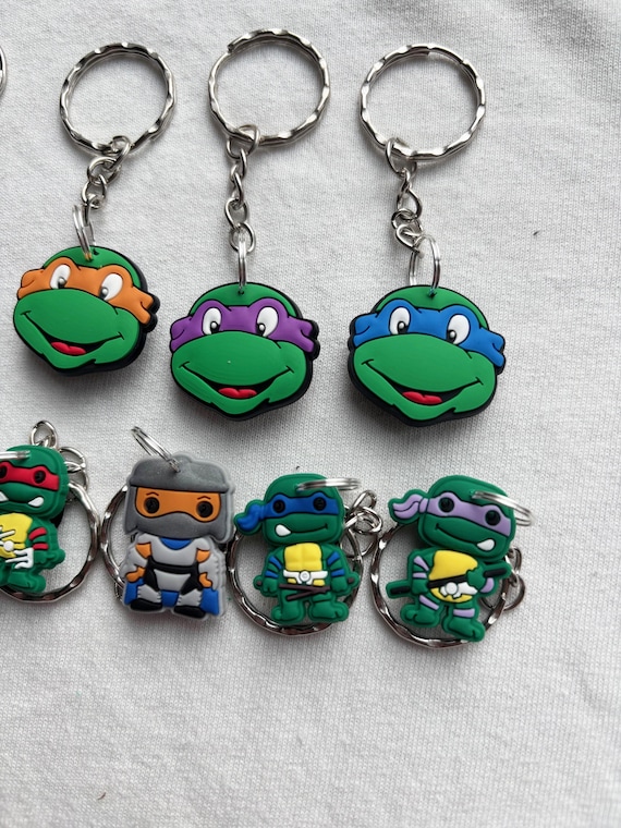 Portachiavi Ufficiale Teenage Mutant Ninja Turtles – 3 Ciondoli: Guscio, Pizza E Nunchaku, Multicolore