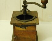 Coffee Grinder made of cast metal and wood with dovetail joints, tabletop manual coffee mill with door, handle reads PATD MAY 15, 1888