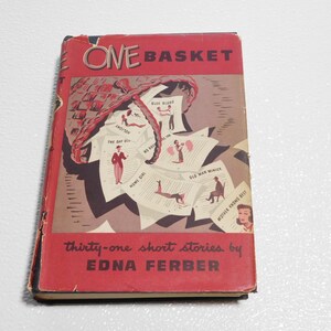 May include: A red book titled "One Basket" with a vintage illustration of a woven basket overflowing with papers, each with a different title and illustration. The text "thirty-one short stories by Edna Ferber" is printed below the title.