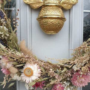 Bee door knocker by brass bee