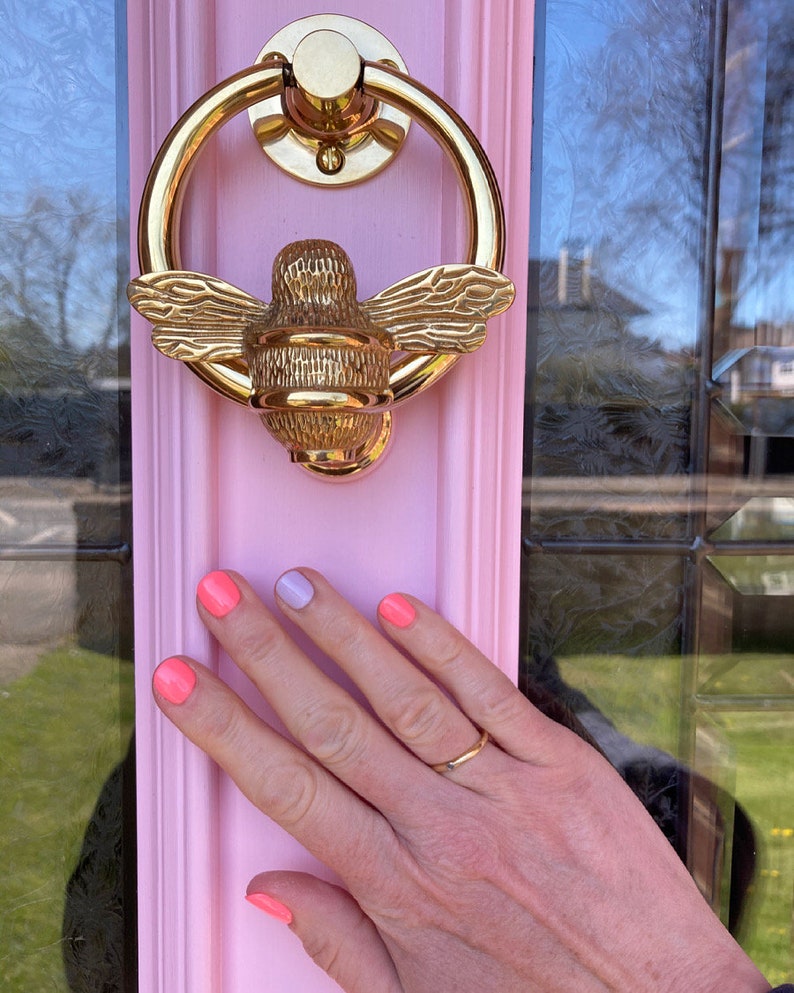 Bee door knocker by brass bee