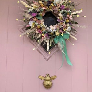 Bee door knocker by brass bee