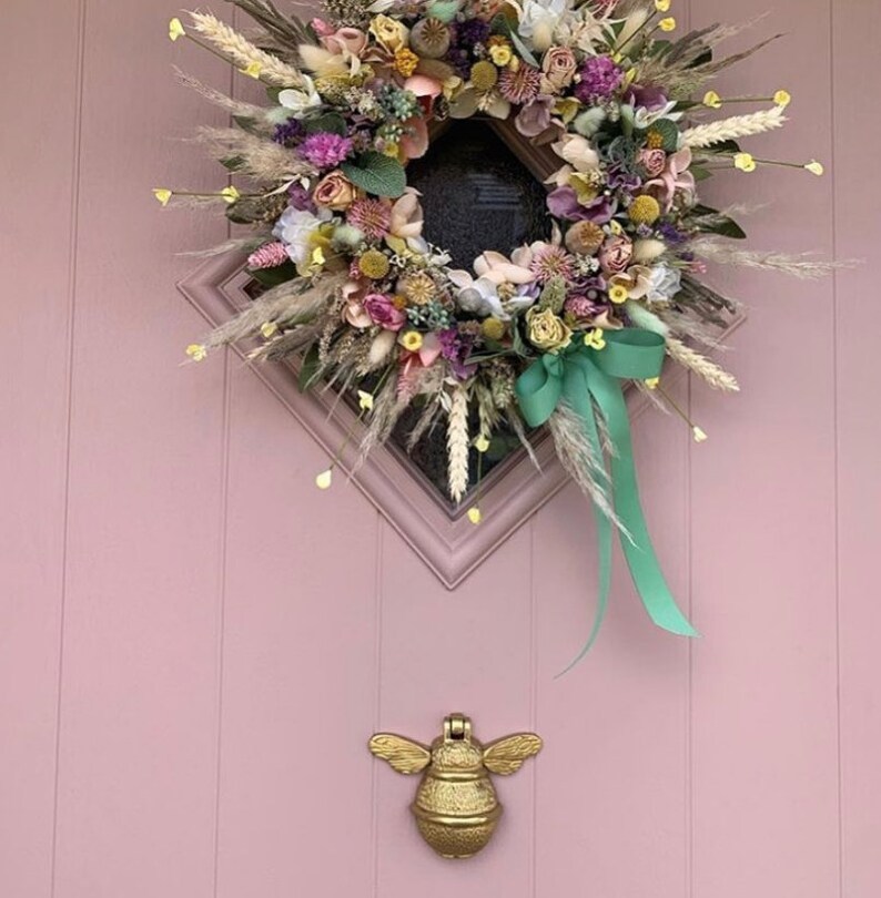Bee door knocker by brass bee