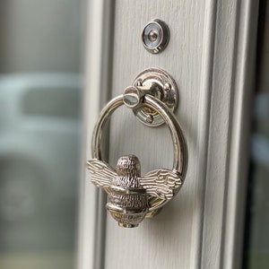 Bee door knocker by brass bee