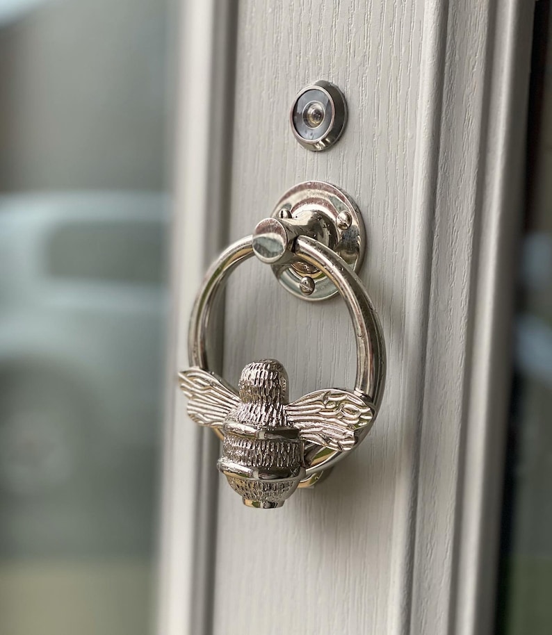 Bee door knocker by brass bee