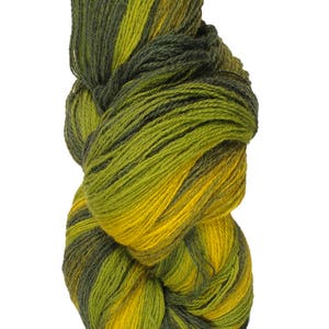 May include: A skein of yarn in shades of green and yellow. The yarn is twisted and knotted, showing the different colors.