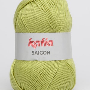 May include: A ball of light green yarn with a white label that says "Katia SAIGON" in red letters.