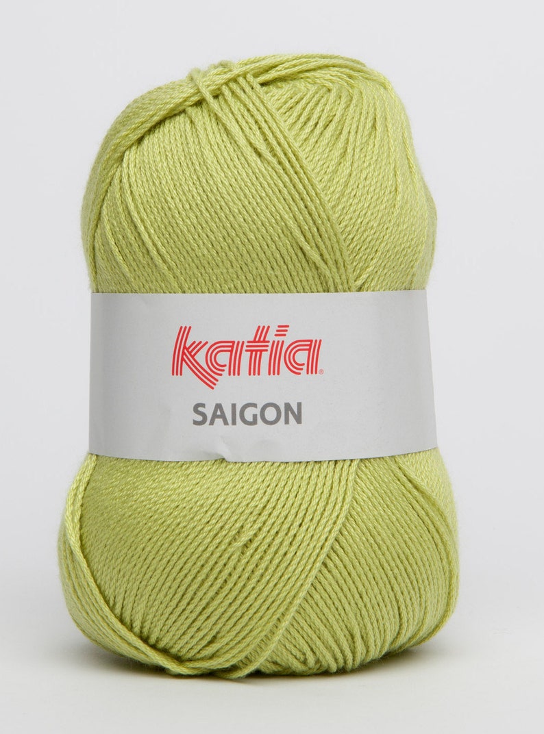 May include: A ball of light green yarn with a white label that says "Katia SAIGON" in red letters.