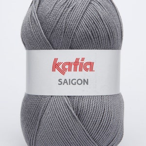 May include: A ball of gray yarn with the Katia brand label and the text "SAIGON" on it.