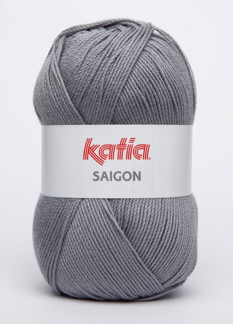 May include: A ball of gray yarn with the Katia brand label and the text "SAIGON" on it.