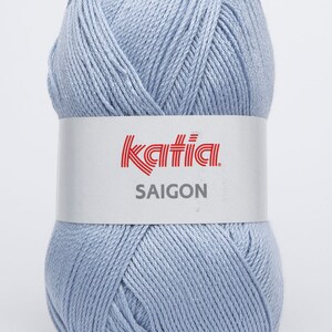 May include: A ball of light blue yarn with the Katia brand label and the text "SAIGON" on it.